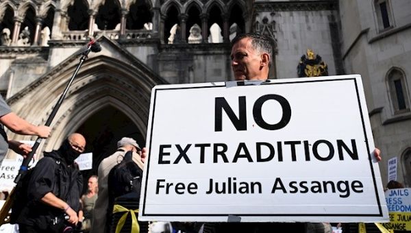 Supporters of Wikileaks founder Julian Assange protest outside the Royal Courts of Justice in London, Britain, 11 August 2021.