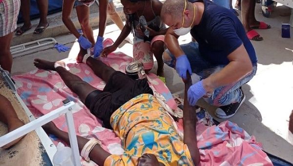 Cuban Medical Brigade helping an injured person after an earthquake in Jeremie, Haiti, Aug. 14, 2021.