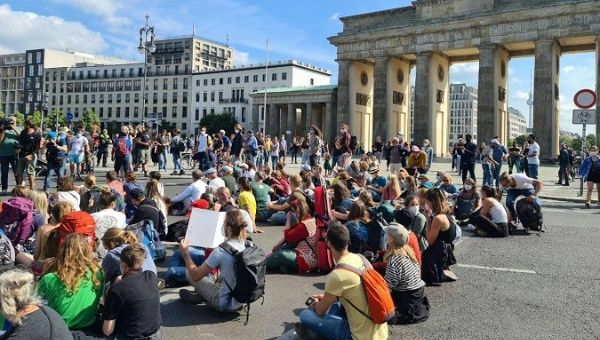 Sit-in in front of the Brandenburg Gate, Berlin, Germany, Aug. 16, 2021. 