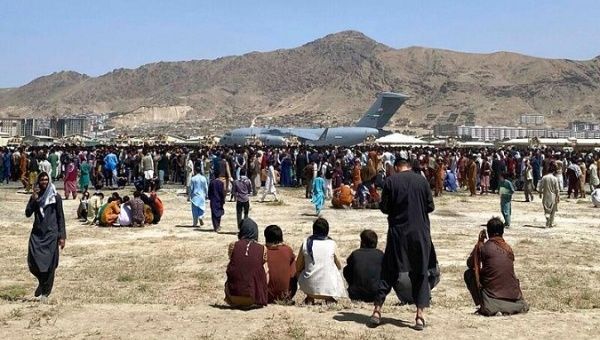 Afghans try to leave their country through Kabul airport, Afghanistan, Aug. 24, 2021.