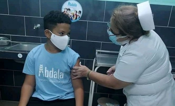 A nurse vaccinates a child with Abdala COVID-19 vaccine, Camaguey, Cuba, 2021.