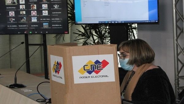 An electoral officer certifies a voting machine, Caracas, Venezuela, Sept. 10, 2021.