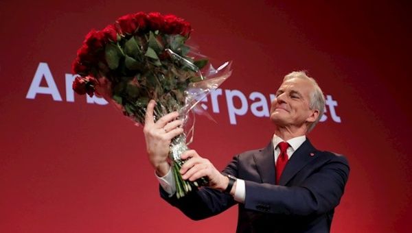 Labor leader Jonas Gahr Store with a bouquet of red roses at the Labor Party's election vigil at Folkets hus in Oslo, Norway, 13 September 2021, during the 2021 parliamentary elections.