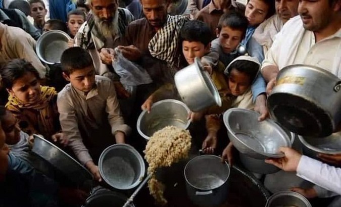 Children receive food assistance, Afghanistan, 2021.