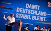 German Chancellor Angela Merkel (L) speaks at CDU/CSU coalition closing campaign, Munich, Germany, Sept. 24, 2021.