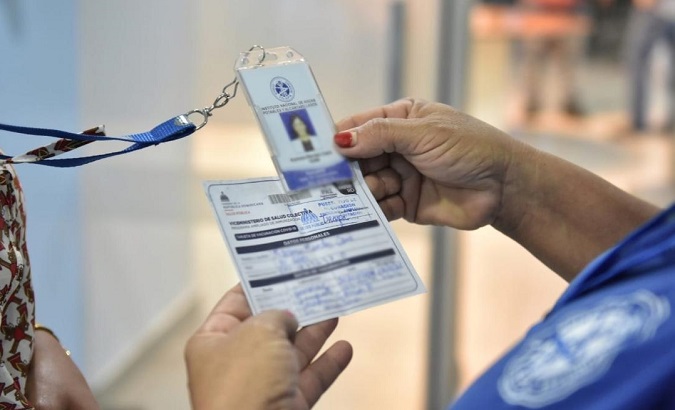 An inspector checks a citizen’s vaccination card, Dominican Republic, Oct. 18, 2021.