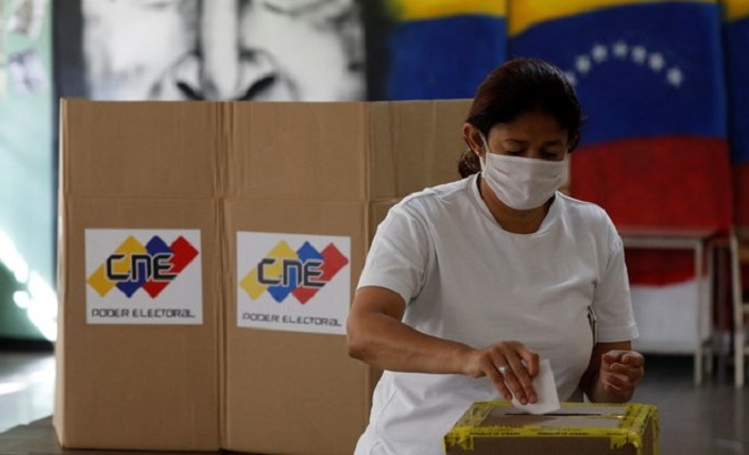 A citizen exercises her right to vote, Venezuela.