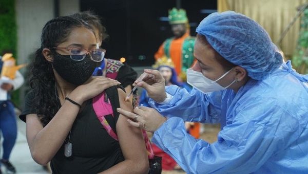 A girl gets a COVID-19 vaccine, La Guaira, Venezuela, Nov. 12, 2021.
