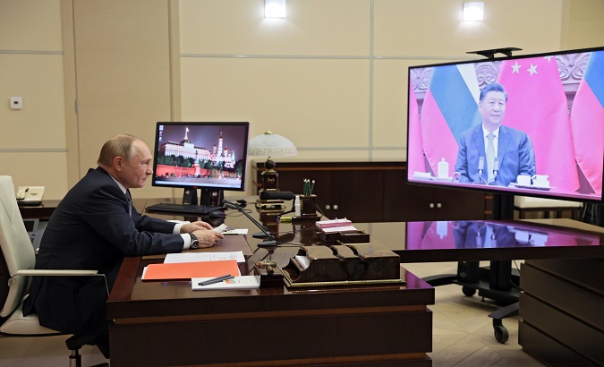 Virtual meeting between Russia's President Vladimir Putin (L) and China's President Xi Jinping (R), Dec. 15, 2021.