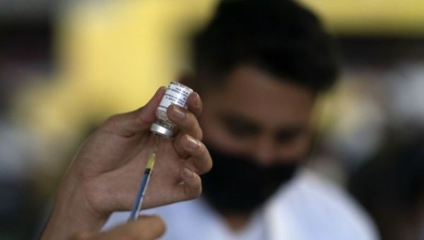 A health worker prepares a dose of the COVID-19 vaccine in Mexico City, Mexico, on Aug. 11, 2021.