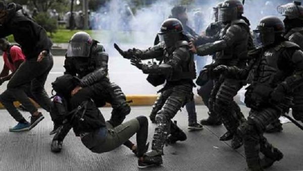 Members of the police riot squad attack a citizen, Colombia, 2021.