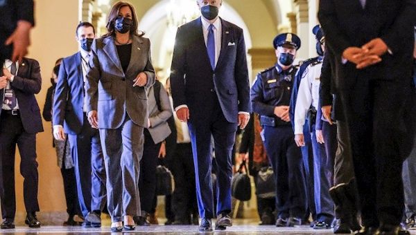 US President Joe Biden and Vice President Kamala Harris depart after delivering speeches to mark the first anniversary of attack on the US Capitol by supporters of former President Donald Trump