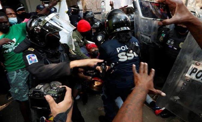 Police beat Haitian migrant, Mexico City, Mexico, Jan. 13, 2022.