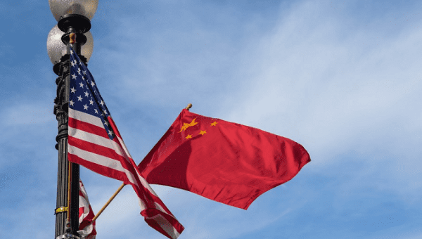 Photo showing the national flags of China (R) and the United States (L).