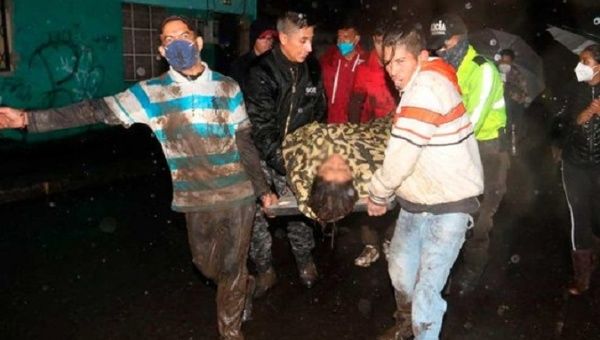 Citizens rescue an injured person, Quito, Ecuador, Jan. 31, 2022.
