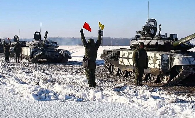 Russian tanks begin to roll away from the Ukrainian border, Feb. 15, 2022.