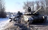 Russian tanks move away from the border area with Ukraine, Feb. 16, 2022.