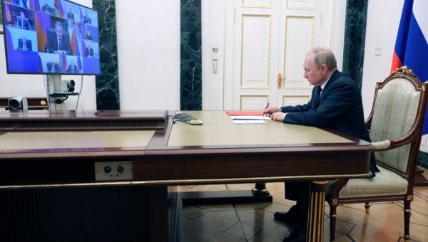 Russian President Vladimir Putin chairs a meeting with permanent members of the Russia's Security Council via teleconference call at the Kremlin in Moscow