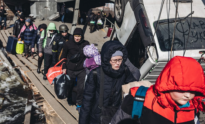 People evacuate in Irpin, Ukraine, March 11, 2022.