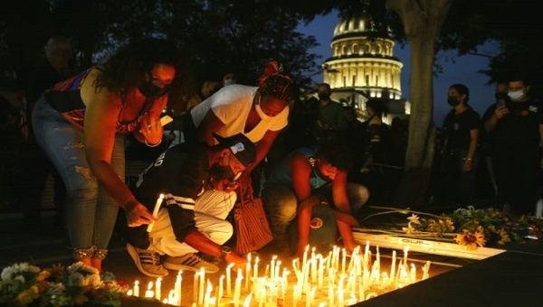 Citizens pay tribute to the victims of the Saratoga hotel gas explosion, Havana, Cuba, May 13, 2022.