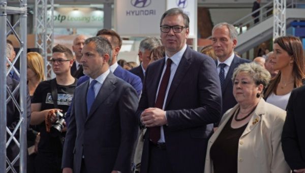 Serbian president Aleksandar Vucic (C) attends the opening of the 7th Belgrade's car and motorcycle fair in Belgrade, Serbia, May 12, 2022
