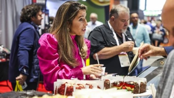 Visitors try food samples at the National Restaurant Association (NRA) Show in Chicago, the United States, May 22, 2022. The show is held from May 21 to 24 in Chicago.