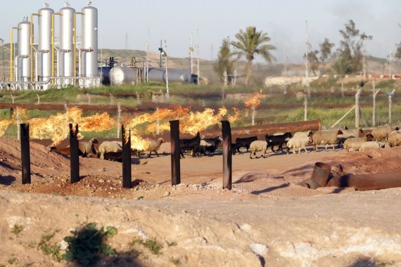 Photo taken on March 7, 2016 shows fire as oil is extracted from Baba Karkar field near the Iraqi city of Kirkuk.