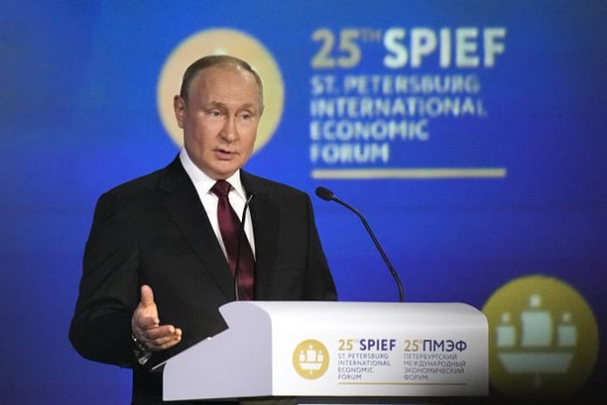 President Vladimir Putin told Russia's showpiece investment conference Friday that the country's economy will overcome sanctions that he called 