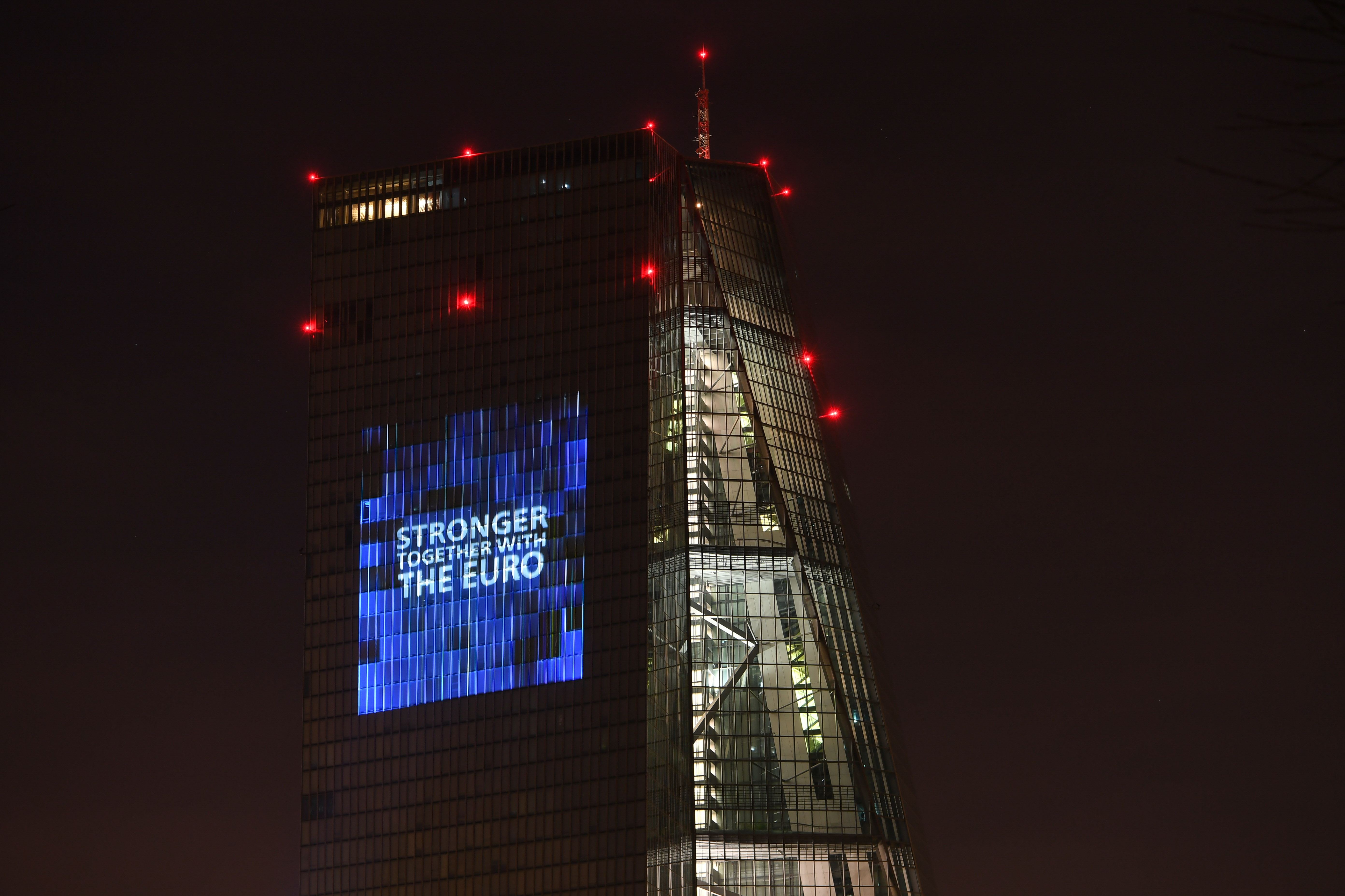 Photo taken on Jan. 1, 2022 shows the headquarters of the European Central Bank illuminated to celebrate the 20th anniversary of Euro banknotes and coins in Frankfurt, Germany.