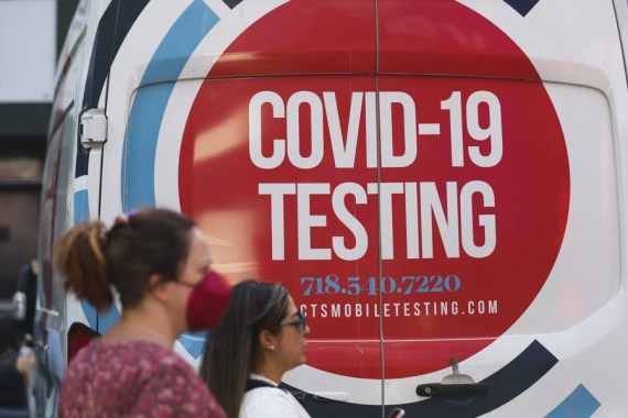 Pedestrians walk past a COVID-19 testing site on Times Square in New York, the United States, May 17, 2022.