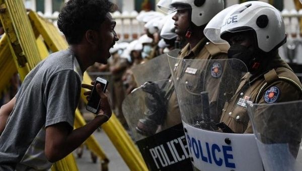 Citizen fearlessly confronts police forces, Sri Lanka, July 21, 2022.