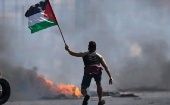 A man holds a Palestinian flag, Aug. 8, 2022.