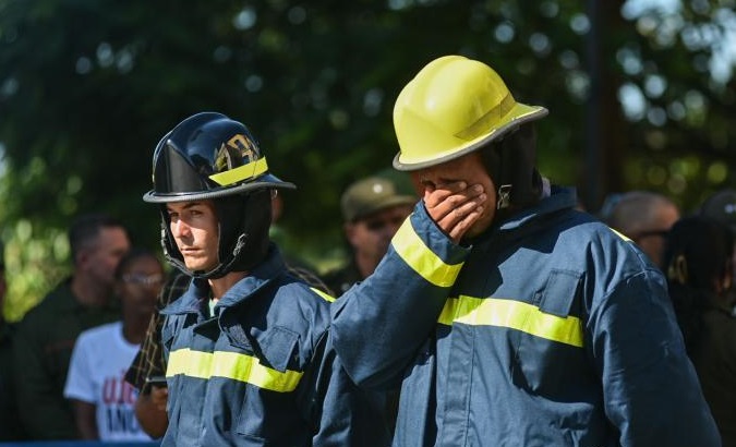 Firefighters during the ceremony in honor of their fallen comrades, Aug. 19, Matanzas, Cuba.