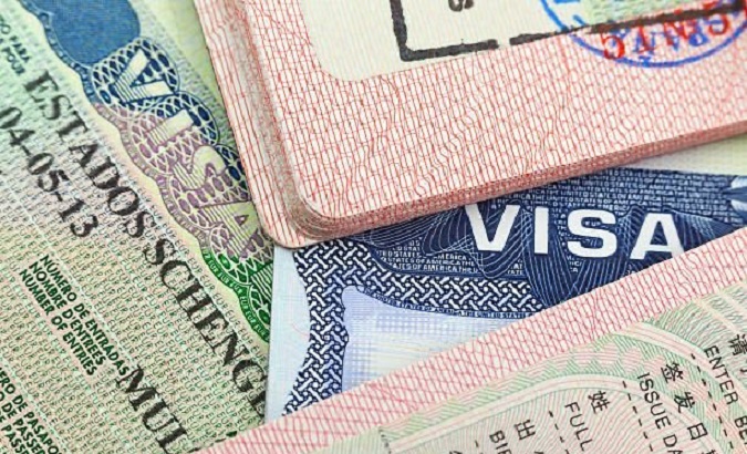Collage with samples of Schengen visas.