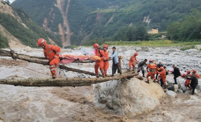 Rescue teams transport earthquake victims in Sichuan, China, Sept. 6, 2022.
