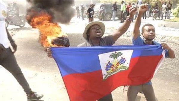At least one person dead after a new day of anti-government protests in Haiti.
