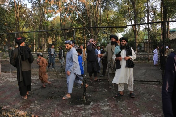 People gather at the site of a blast in Kabul, Afghanistan on Sept. 23, 2022.