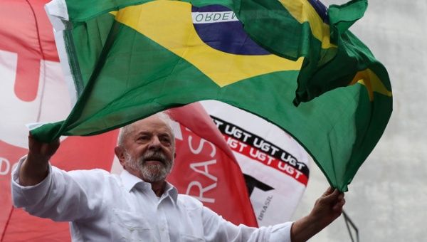 The former president of Brazil and current presidential candidate, Luiz Inácio Lula da Silva, greets his supporters during a tour through the streets of the municipality of Guarulhos