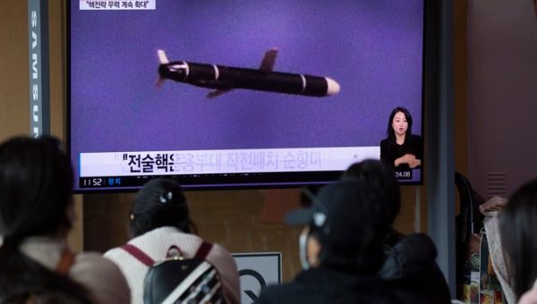 People watch the news at a station in Seoul, South Korea, 13 October 2022.