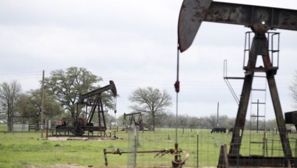 Photo taken on March 12, 2019 shows operating oil pumps in Luling of Texas, the United States.