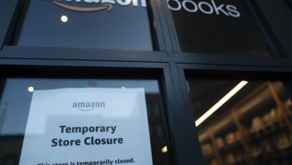 Photo taken on May 7, 2020 shows a window of a temporarily closed Amazon bookstore in Washington D.C., the United States.