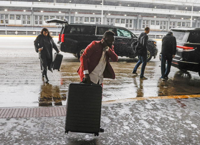 Passengers arrive to check in for their flights before a winter storm hits that threatens to close down air traffic at O'Hare International Airport in Chicago, Illinois, USA, 22 December 2022