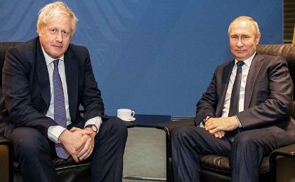 Former U.K. Prime Minister Boris Johnson (L) and Russian President Vladimir Putin (R).