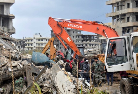 Rescuers work near the rubble of a building destroyed in a powerful earthquake in the city of Jableh, Latakia province, Syria, on Feb. 6, 2023.