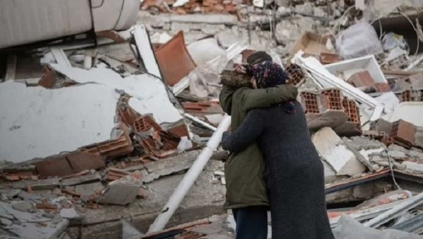 Woman finds a relative after the earthquake in Syria, Feb. 2023.