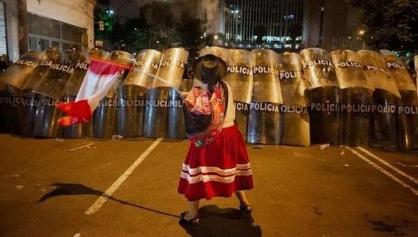 Brave Indigenous woman confronts the Police, Lima, Peru, 2023.