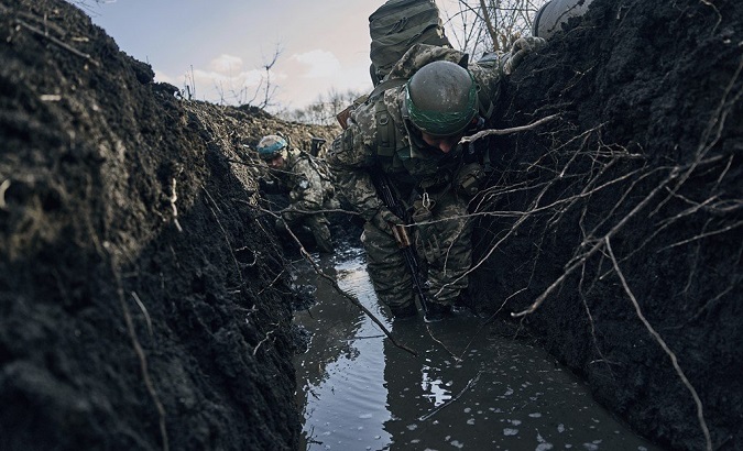 Ukrainian soldiers take refuge in a trench in Bakhmut, March, 2023.