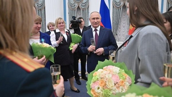President Vladimir Putin (C), Moscow, Russia, March 8, 2023.