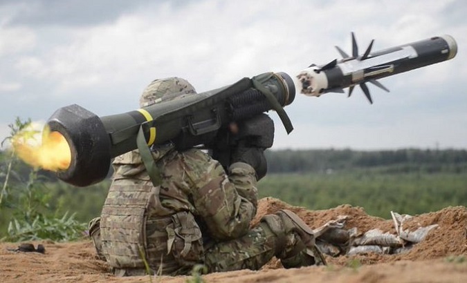 Soldier fires a missile.