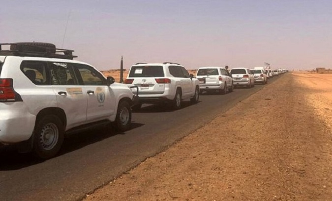 UN car caravan leaving Sudan, April 24, 2023.